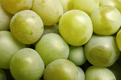 Photo of Bunch of green fresh ripe juicy grapes as background. Closeup view