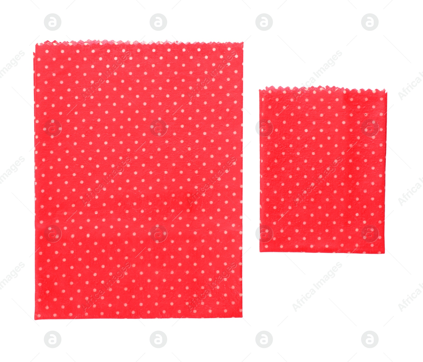 Photo of Red reusable beeswax food wraps on white background, top view