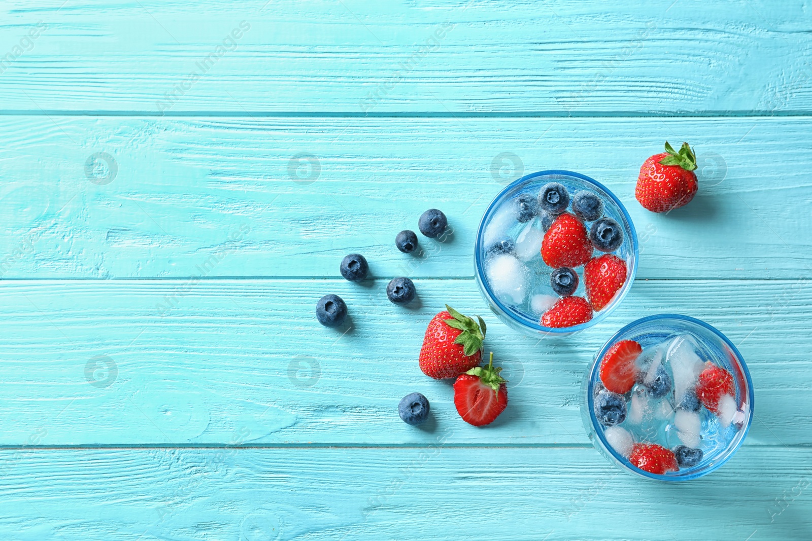 Photo of Flat lay composition with natural lemonade on wooden background