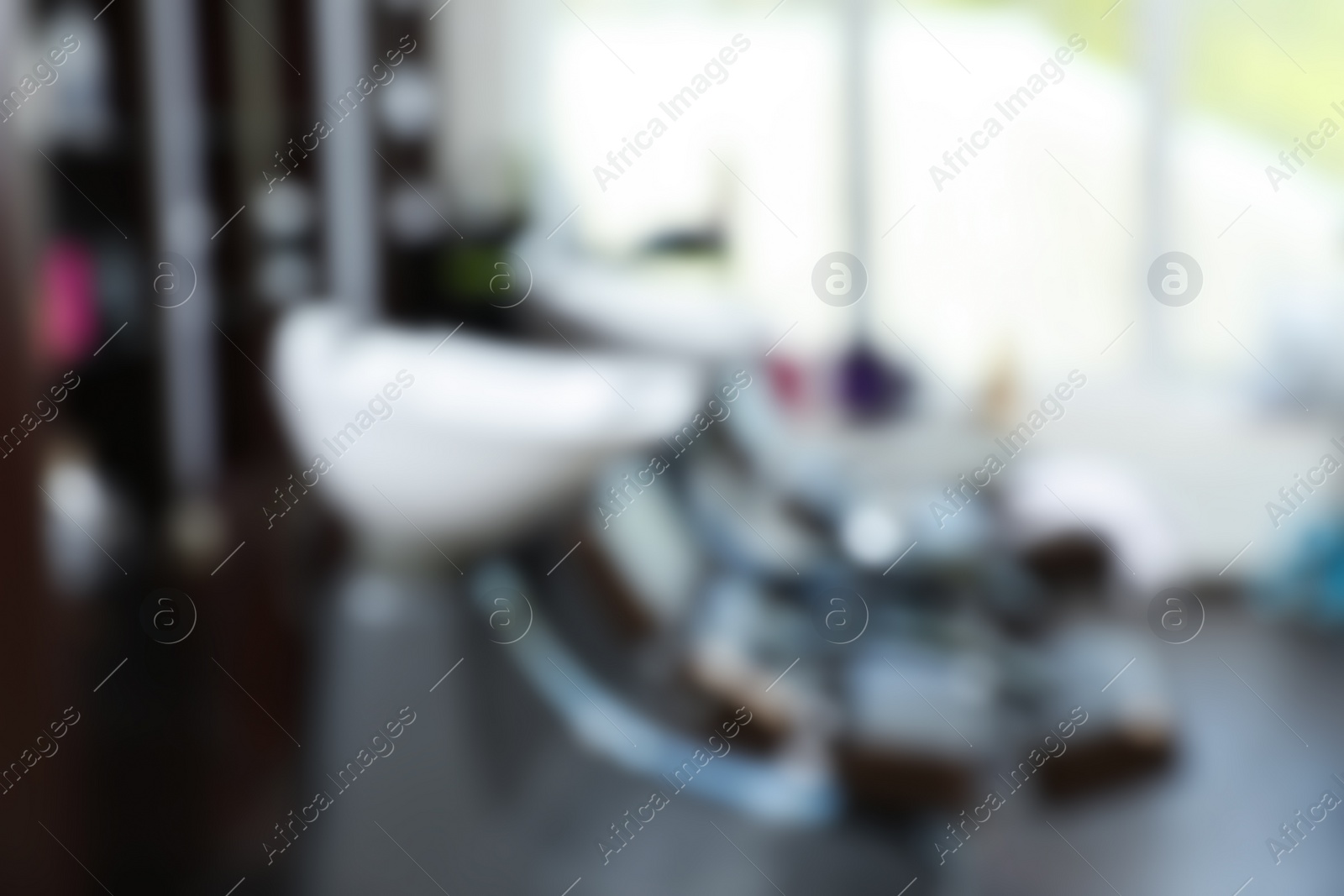 Photo of Blurred view of modern hairdressing salon interior