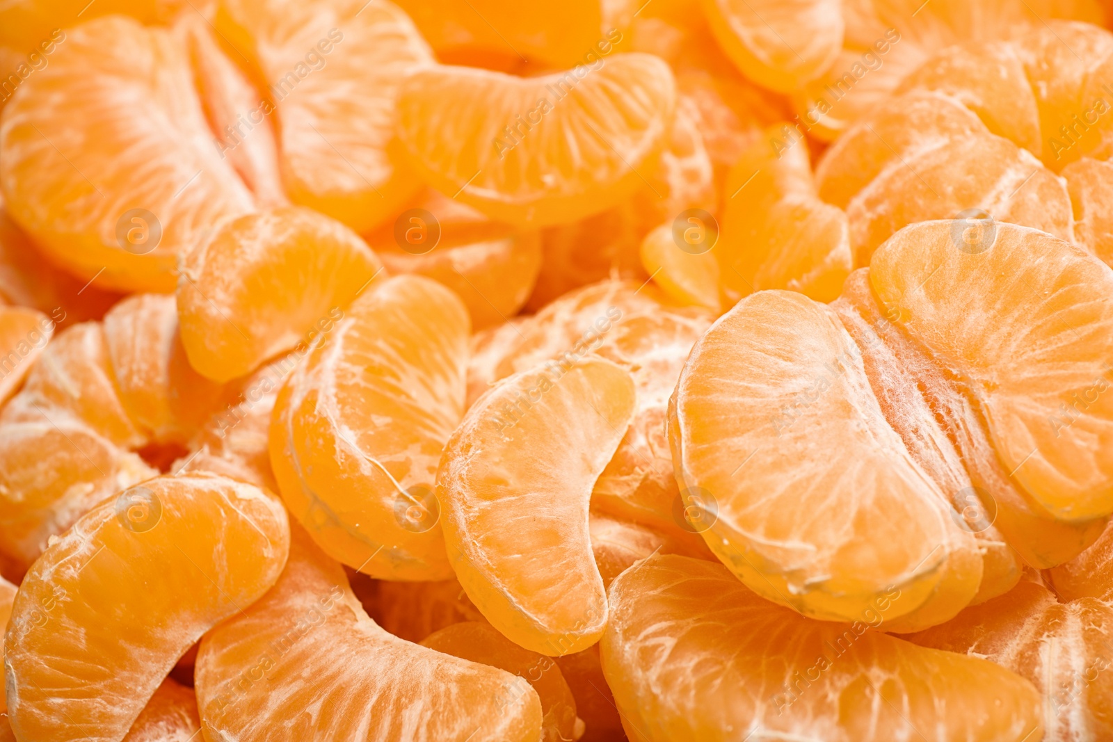 Photo of Peeled fresh ripe tangerines as background, closeup