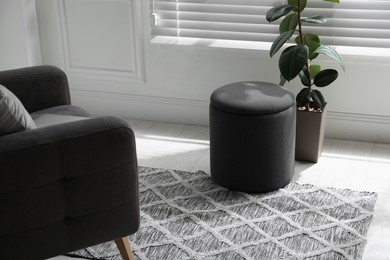 Stylish comfortable ottoman in room. Home design