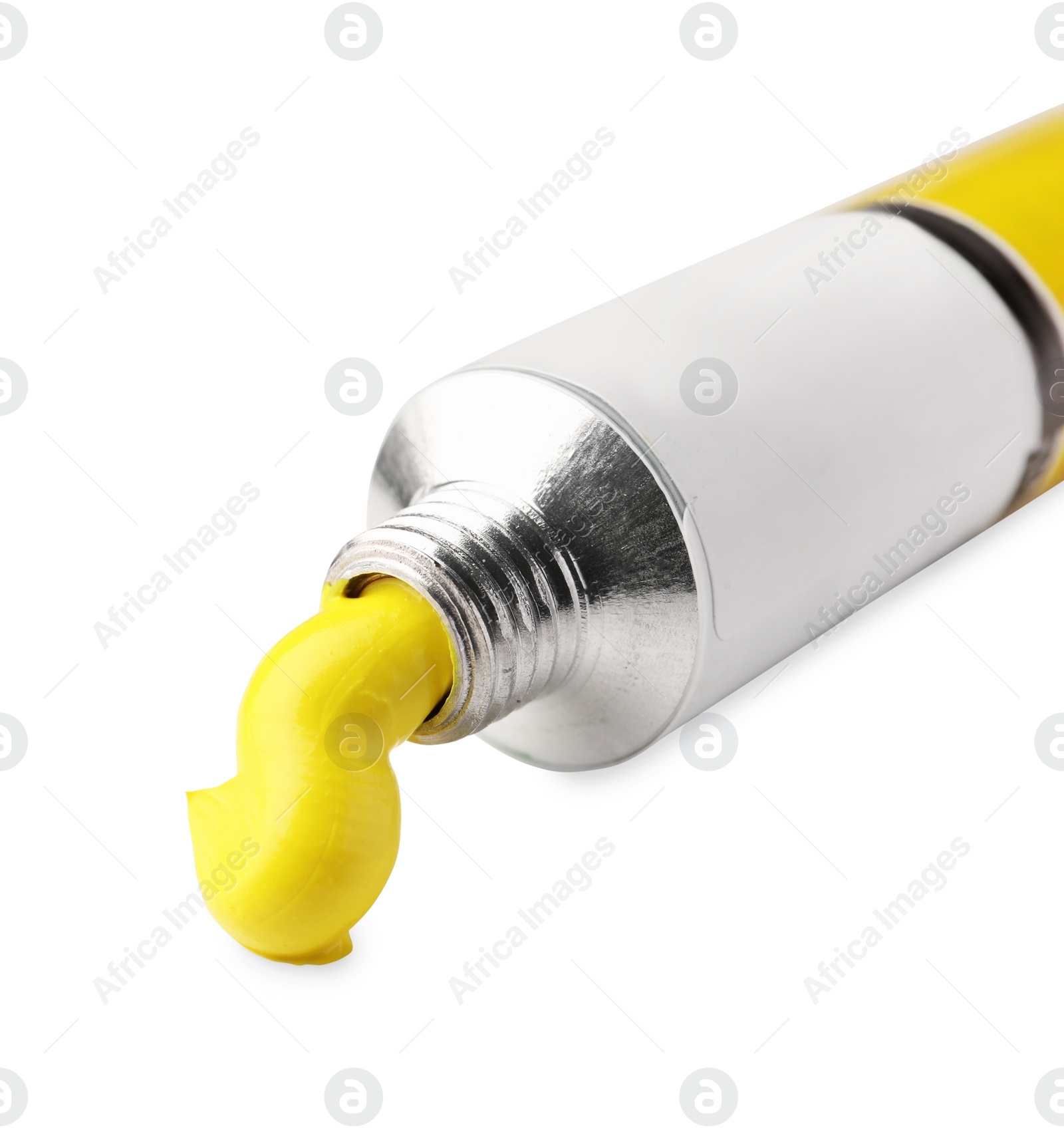 Photo of Tube with yellow oil paint on white background