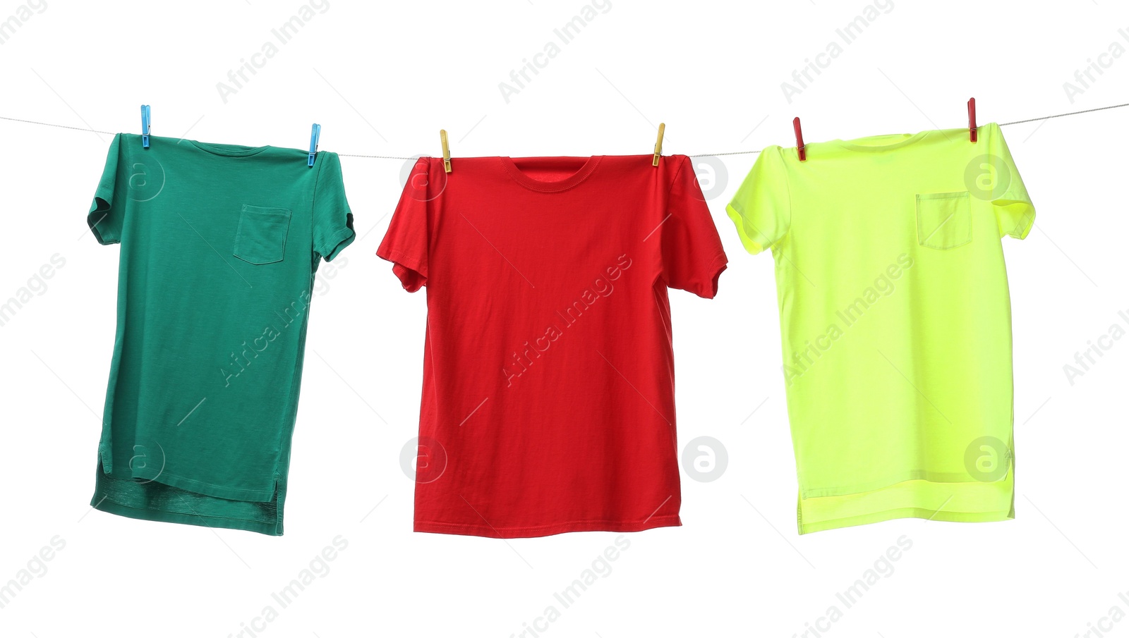 Photo of Colorful t-shirts drying on washing line isolated on white