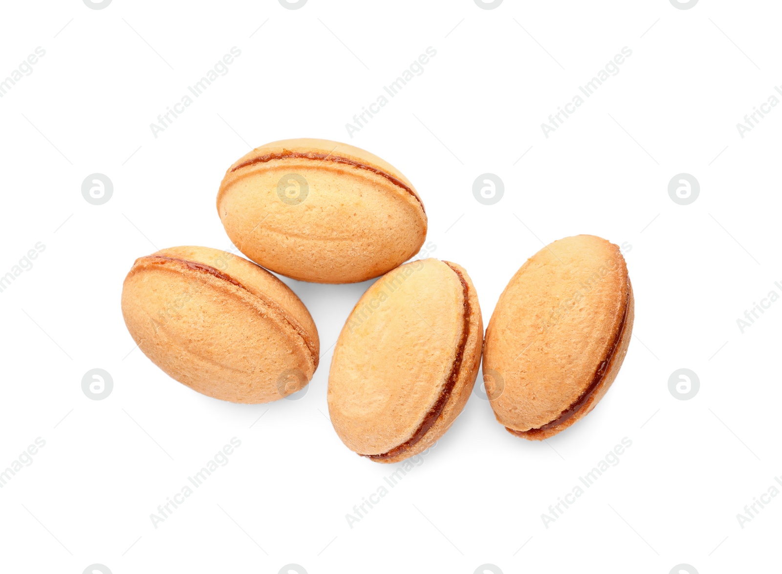 Photo of Delicious nut shaped cookies with boiled condensed milk on white background, top view