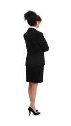 Young businesswoman in suit standing on white background