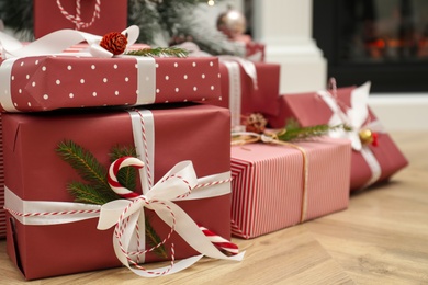 Photo of Many different Christmas gifts on floor indoors