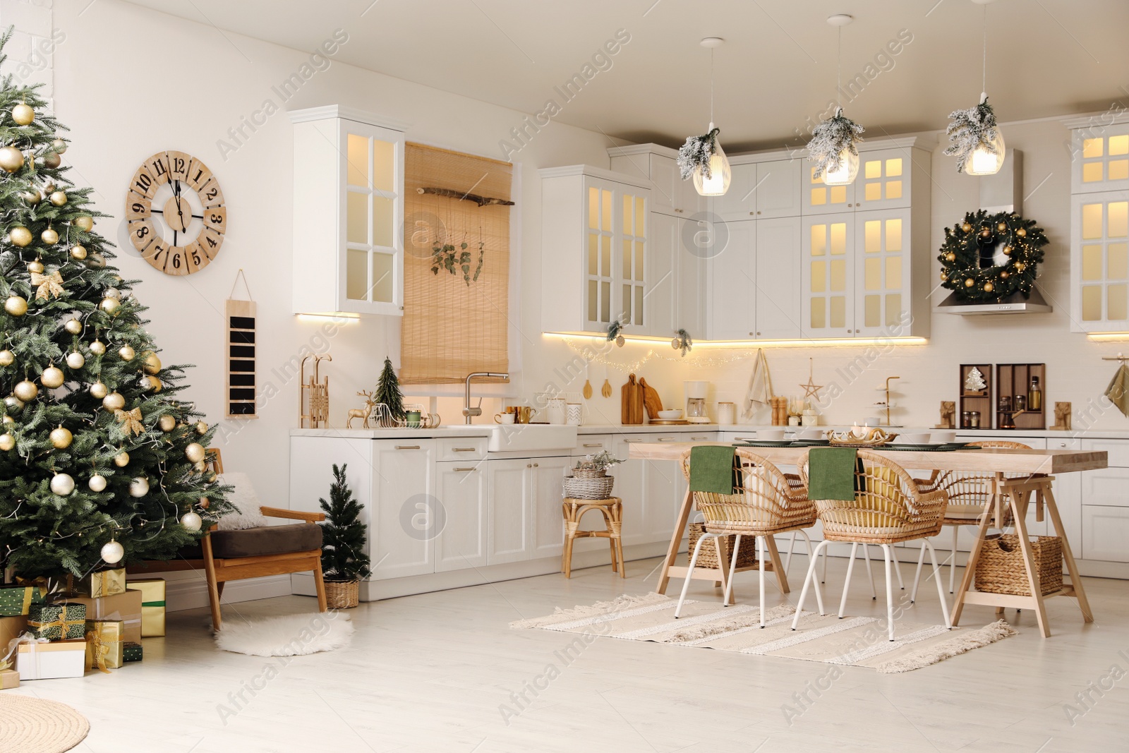 Photo of Cozy open plan kitchen decorated for Christmas. Interior design