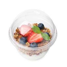 Tasty granola with berries and yogurt in plastic cup isolated on white