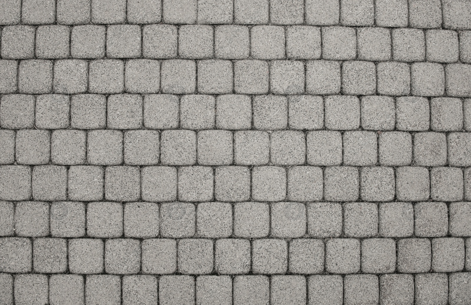 Photo of View on stone sidewal, top view. Footpath covering