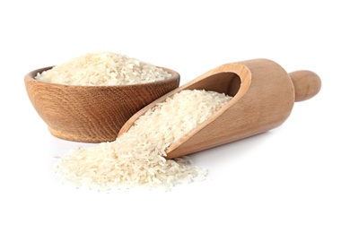 Photo of Bowl and scoop with uncooked long grain rice on white background