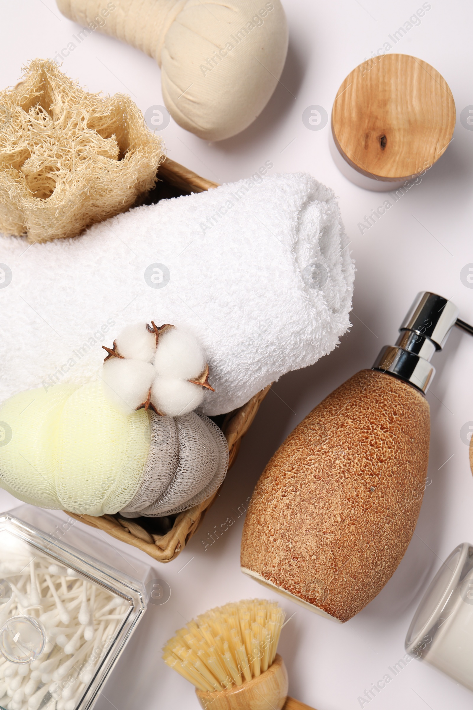 Photo of Bath accessories. Different personal care products and cotton flower on white background, flat lay