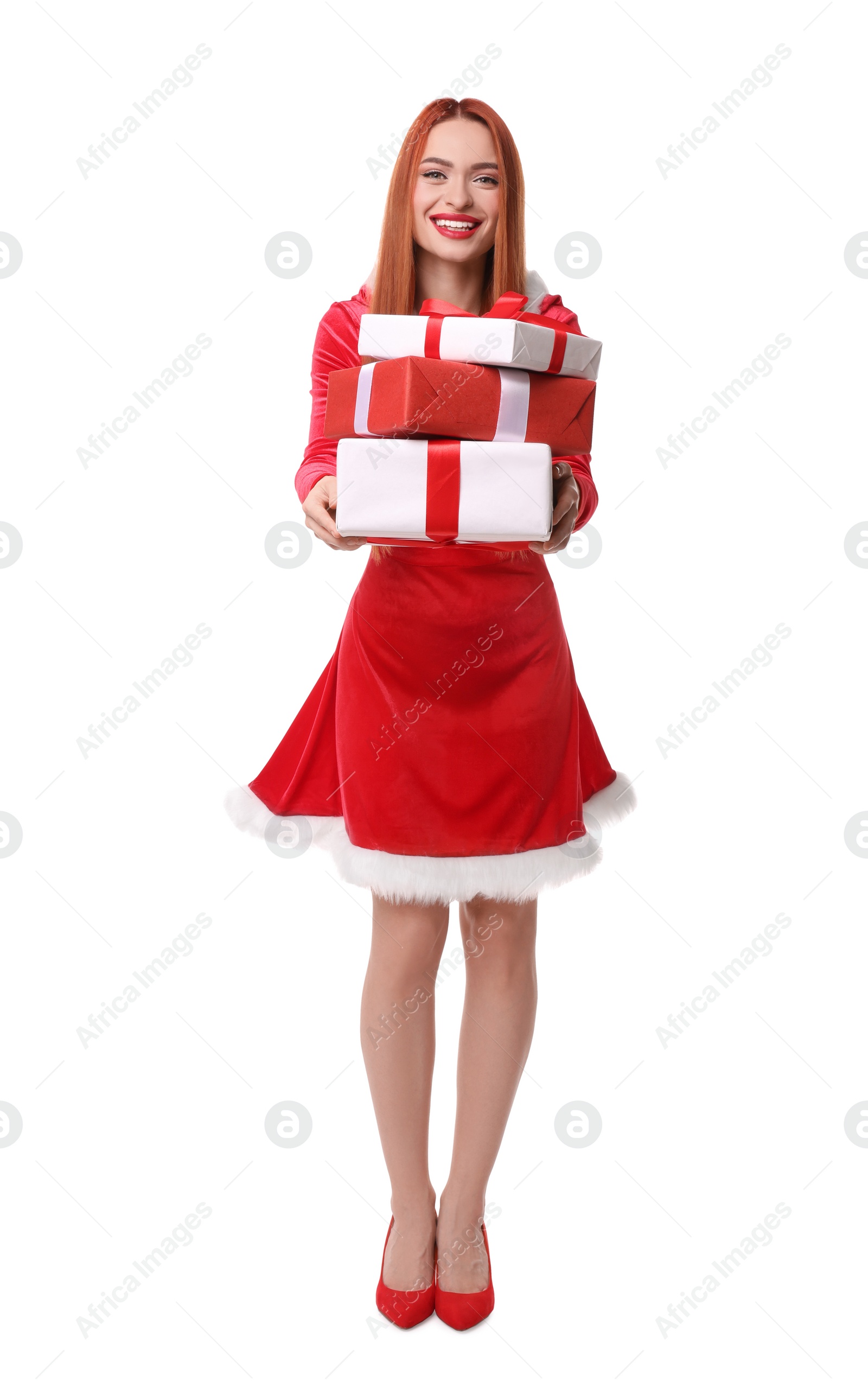 Photo of Young woman in red dress with Christmas gifts on white background