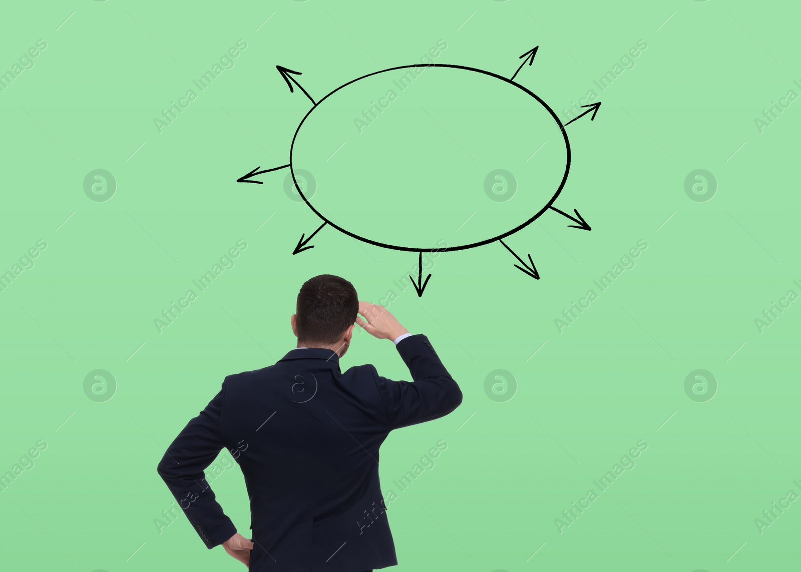 Image of Logic. Man standing in front of diagram on pale green background, back view