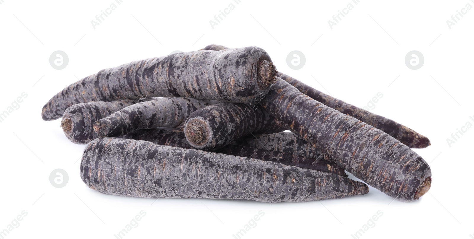 Photo of Fresh raw black carrots isolated on white