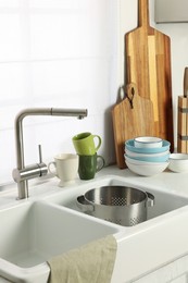 Countertop with sink and cooking utensils in kitchen