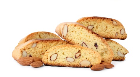 Slices of tasty cantucci and nuts on white background. Traditional Italian almond biscuits