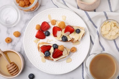 Tasty brie cheese sandwiches on white marble table, flat lay