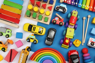 Photo of Different children's toys on color background, flat lay