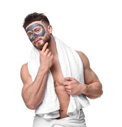 Photo of Handsome man with clay mask on his face against white background