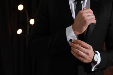 Photo of Man wearing stylish suit and cufflinks, closeup. Space for text