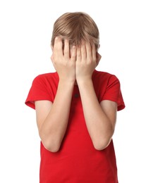 Photo of Boy covering face with hands on white background. Children's bullying