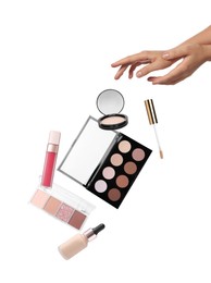 Woman and levitating decorative cosmetics on white background, closeup. Makeup products