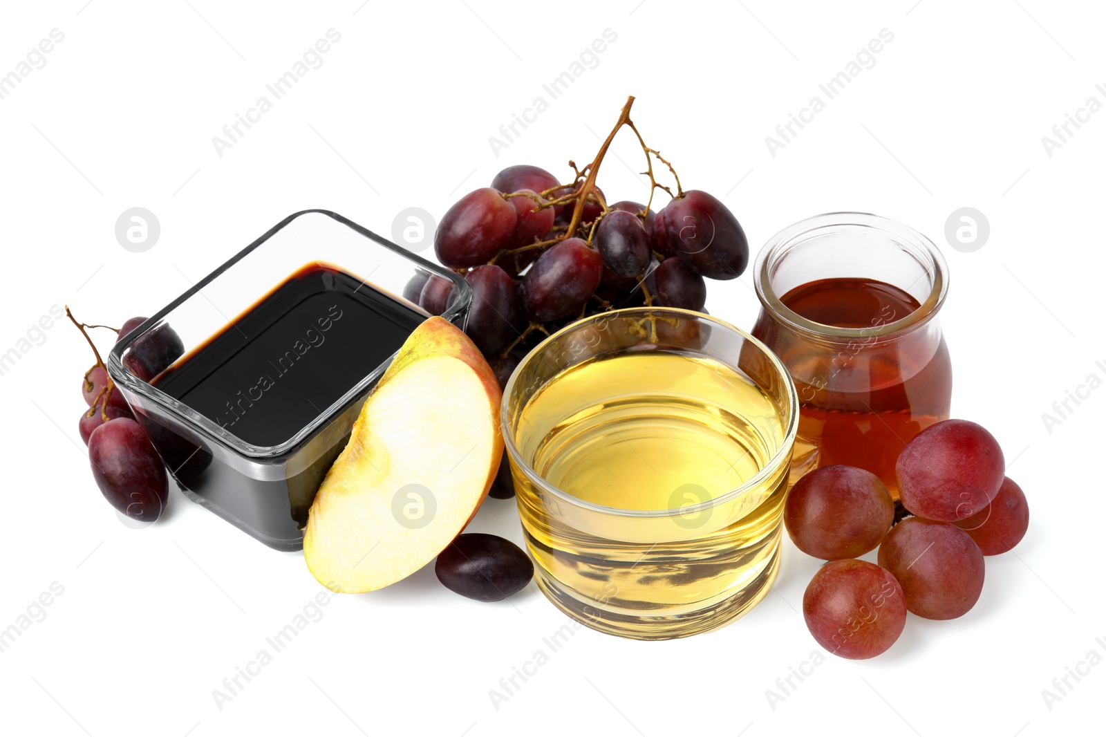 Photo of Different types of vinegar and ingredients isolated on white