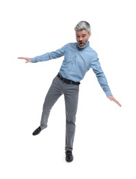 Emotional mature businessman in stylish clothes posing on white background