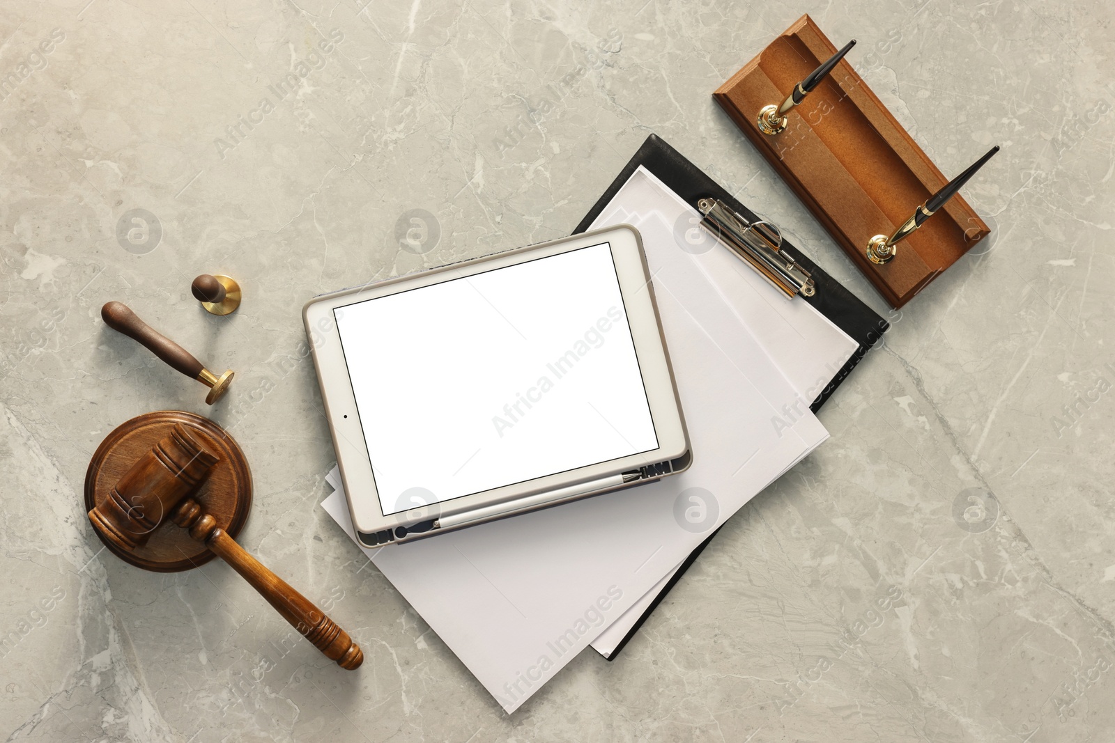 Photo of Flat lay composition with modern tablet on gray marble table. Space for text