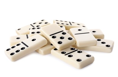 Pile of classic domino tiles on white background