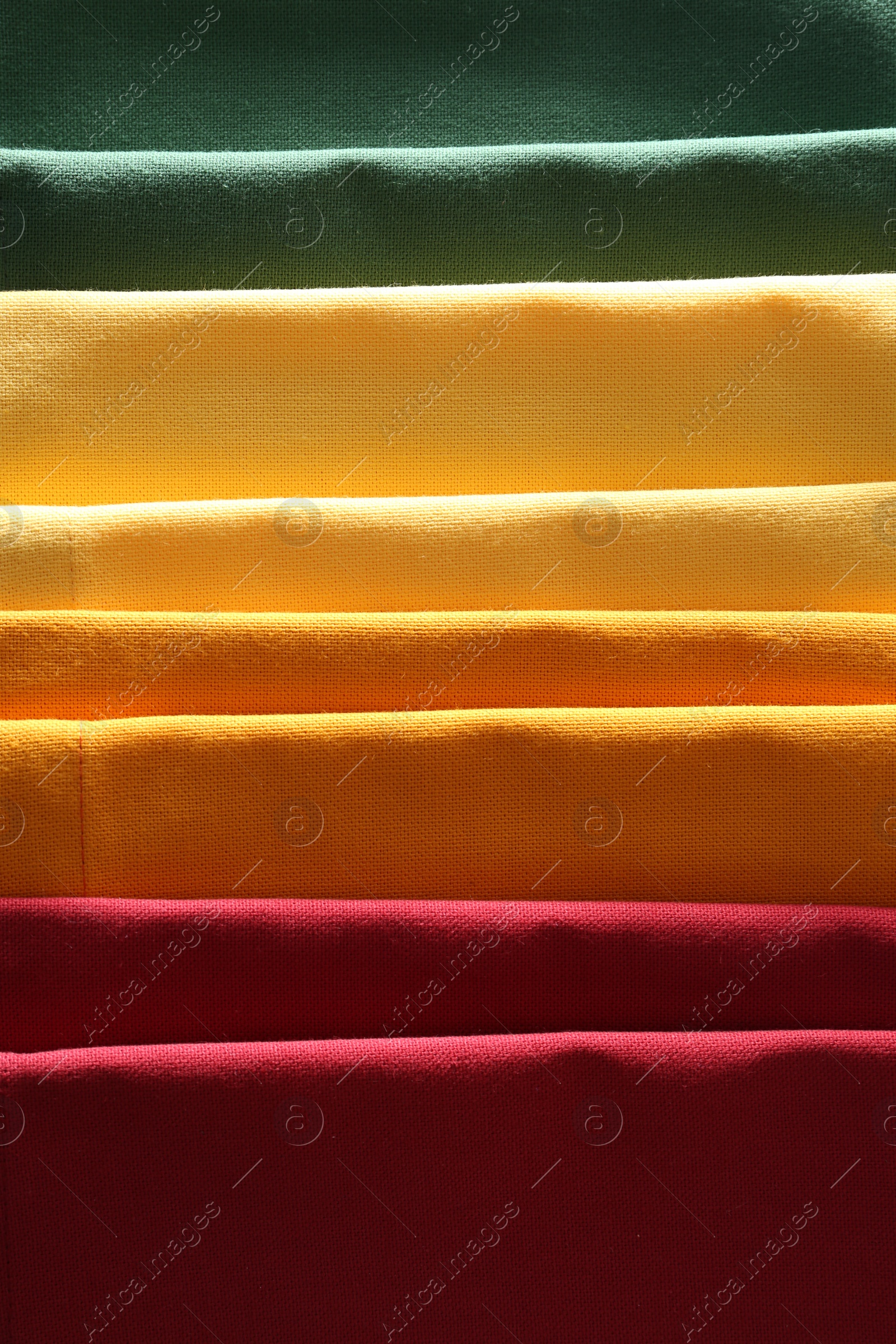 Photo of Different colorful napkins as background, top view