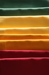 Different colorful napkins as background, top view