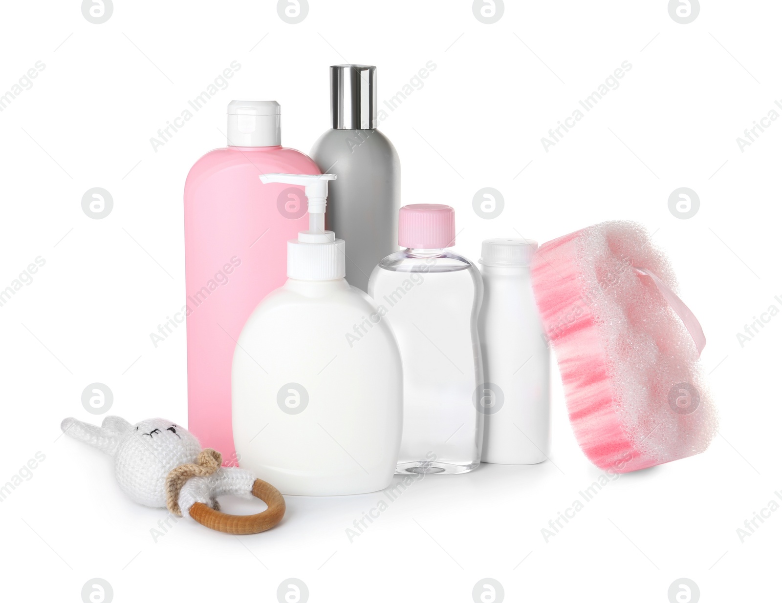 Photo of Bottles of baby cosmetic products, bath sponge and toy on white background