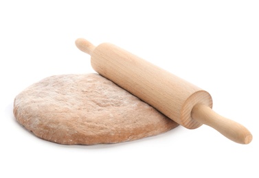 Photo of Raw rye dough and rolling pin on white background