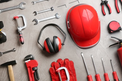 Photo of Flat lay composition with different construction tools on color background