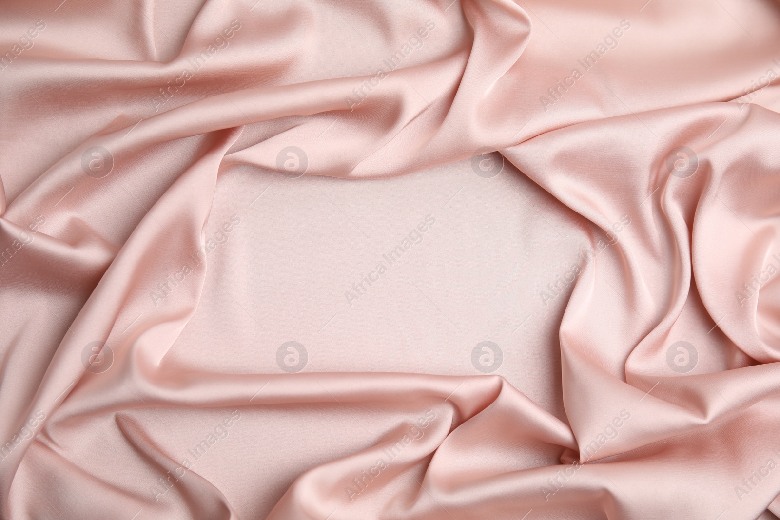 Photo of Texture of delicate pink silk as background, top view