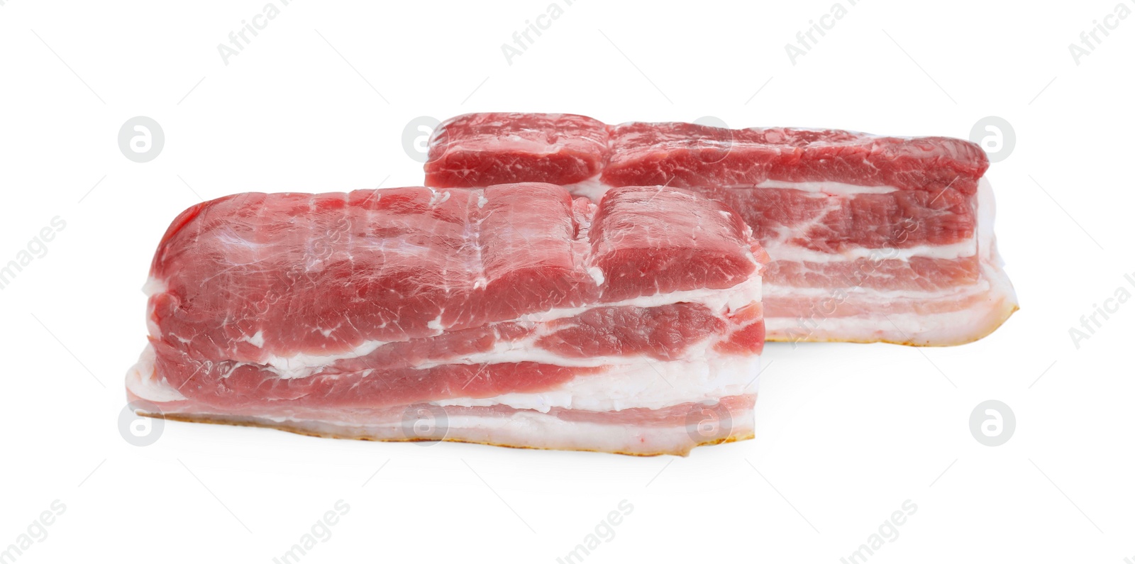 Photo of Pieces of raw pork belly isolated on white