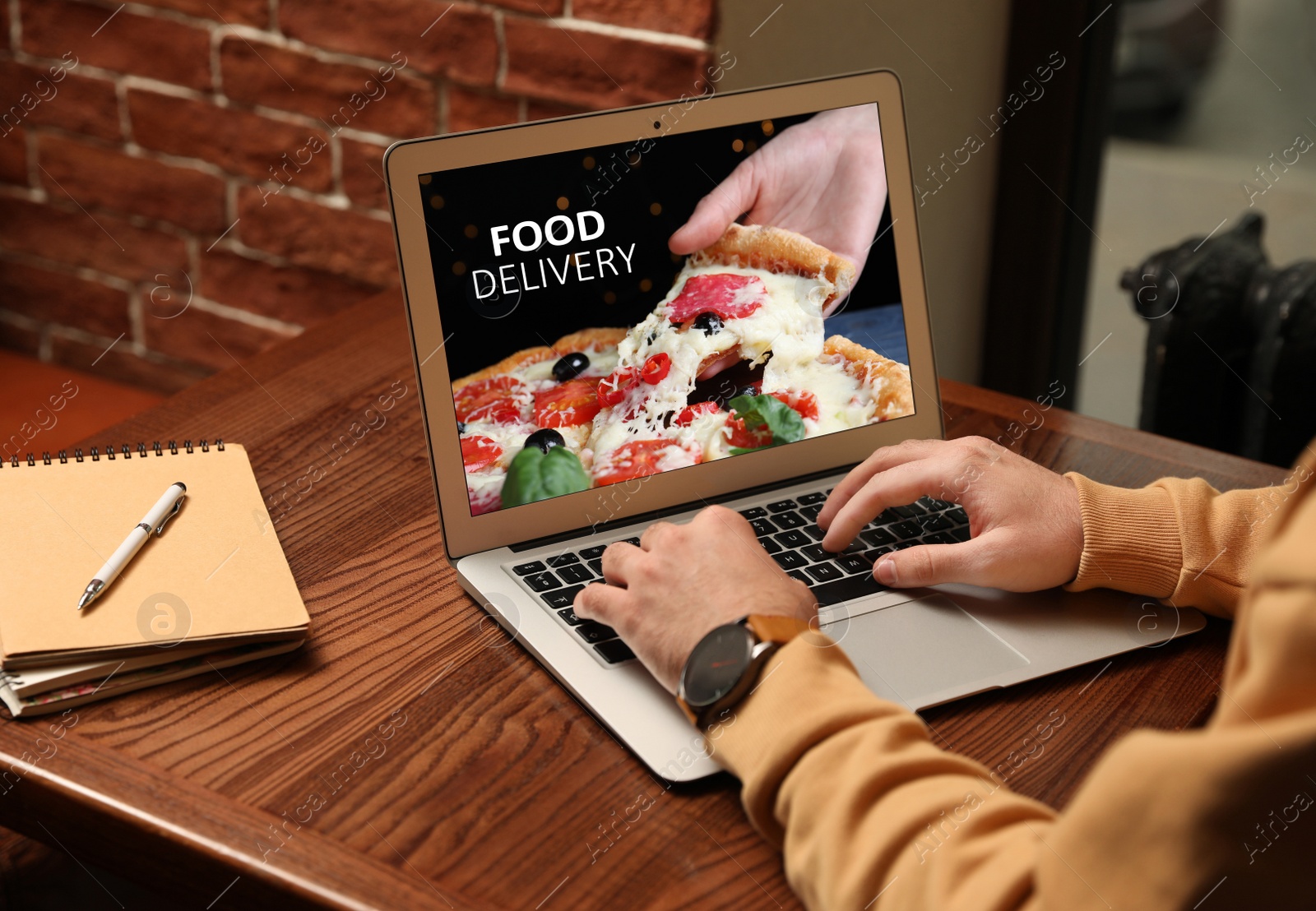 Image of Man using laptop for online food order during quarantine, closeup. Delivery service