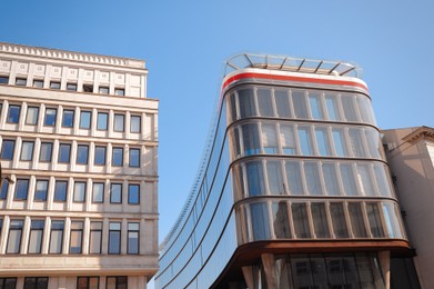 Photo of Low angle view of modern buildings on sunny day