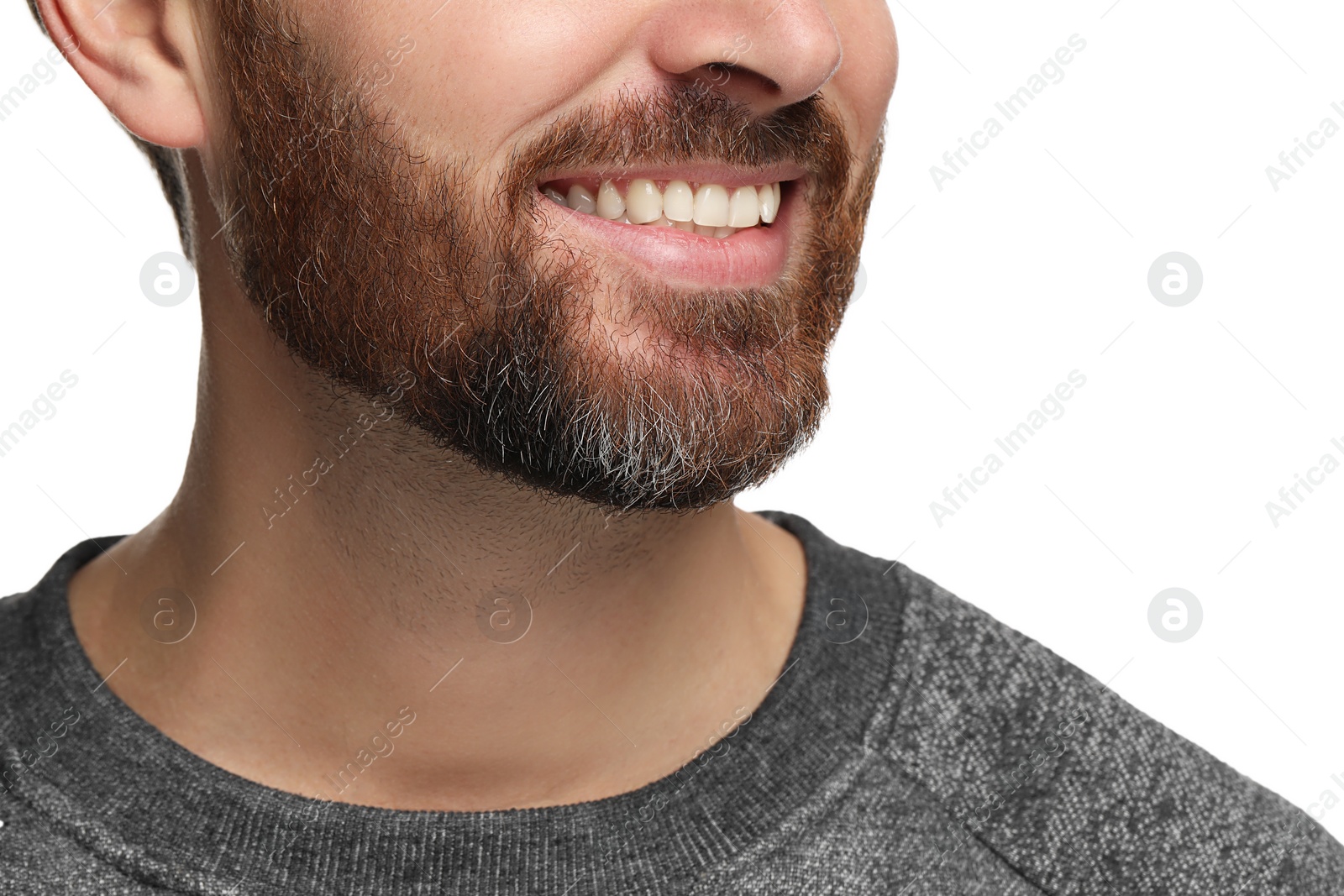 Photo of Smiling man with healthy clean teeth on white background, closeup