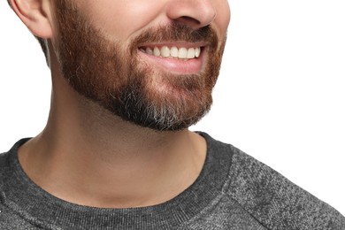 Smiling man with healthy clean teeth on white background, closeup