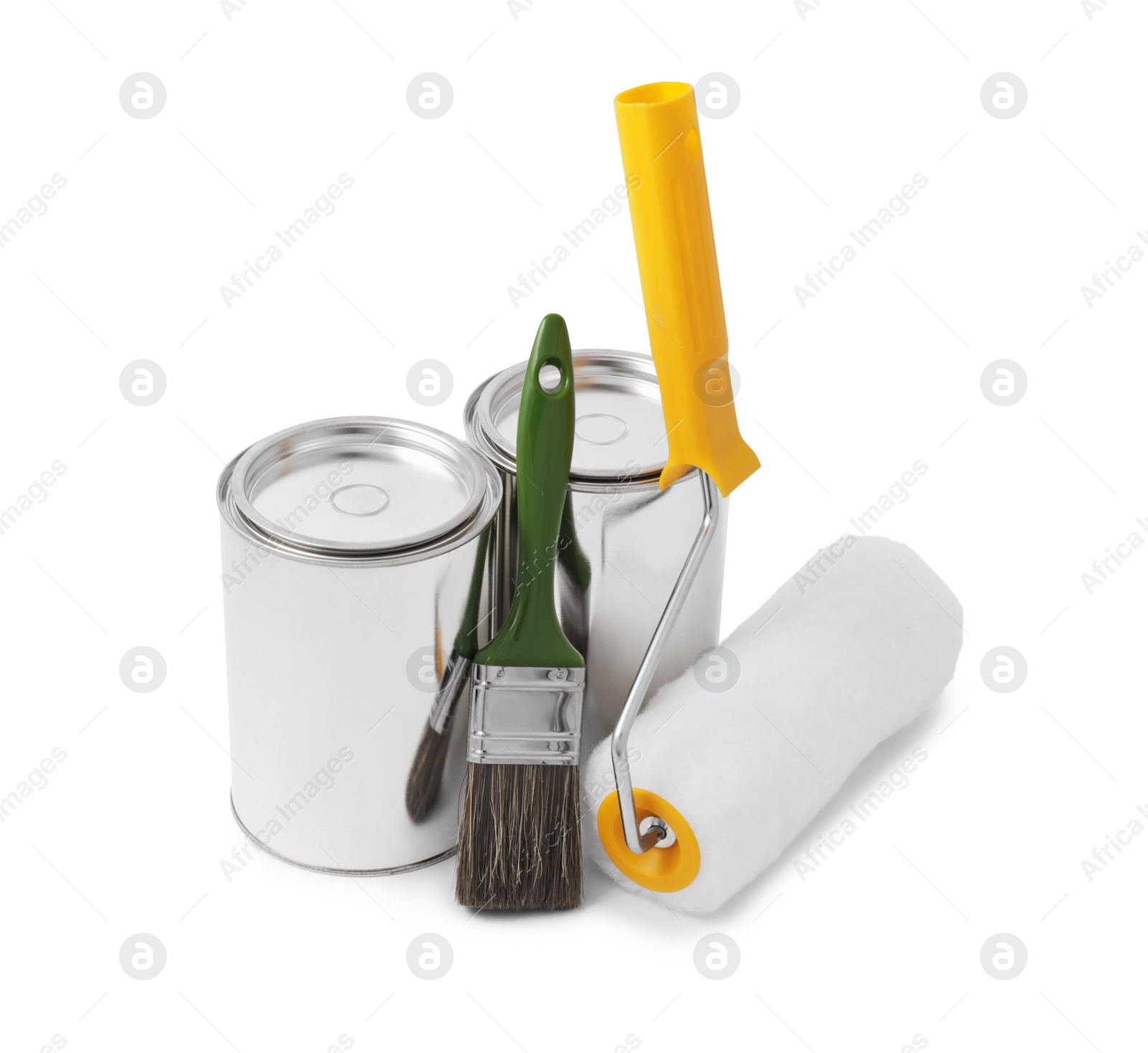 Photo of Cans of paints, brush and roller on white background