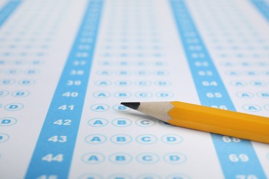 Pencil on answer sheet, closeup. Student passing exam