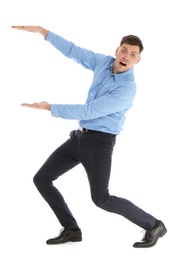 Emotional man in office wear holding something on white background