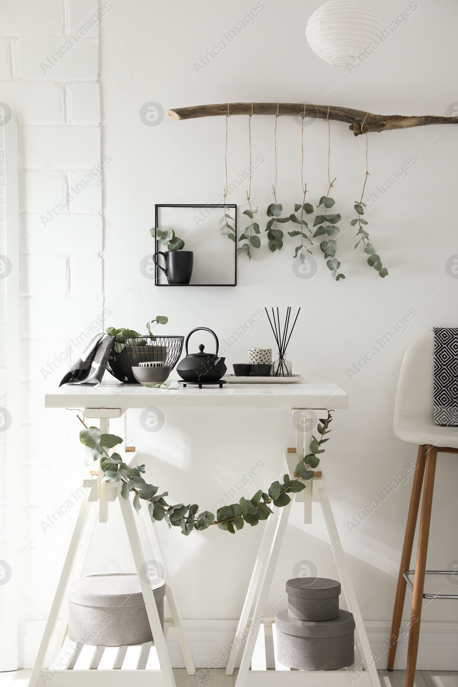 Photo of Stylish room decorated with beautiful green eucalyptus branches