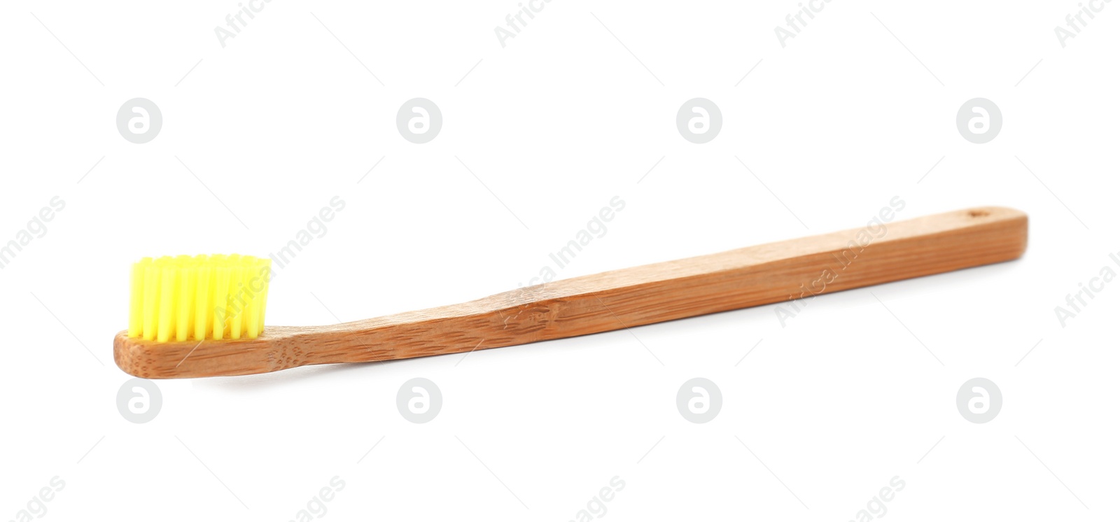 Photo of Bamboo toothbrush on white background. Dental care