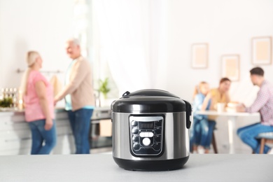 Modern multi cooker on table in kitchen