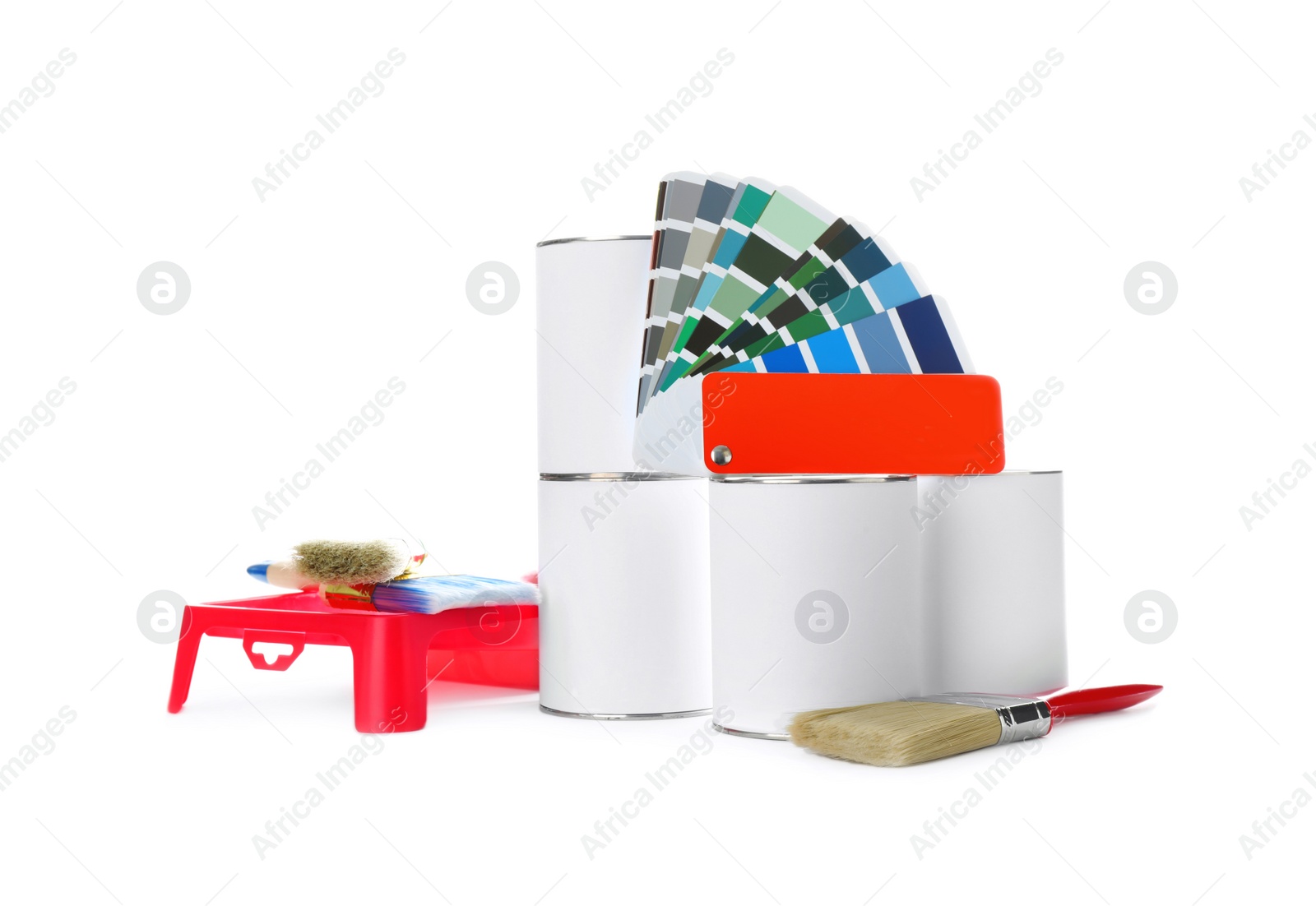 Photo of Closed blank cans of paint with brushes, tray and palette isolated on white