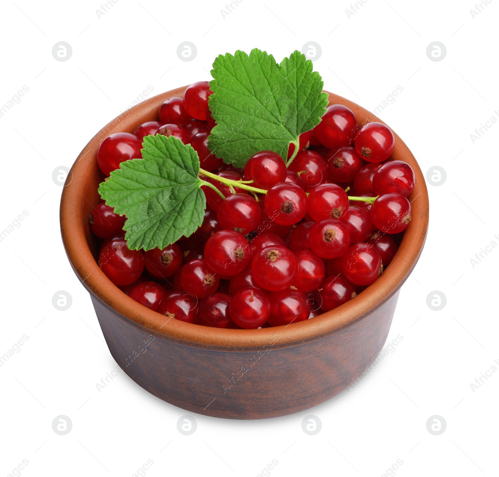 Photo of Tasty ripe redcurrants and green leaves in bowl isolated on white